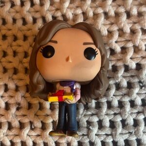 Funko Pop with Brown Hair and Colorful Gift